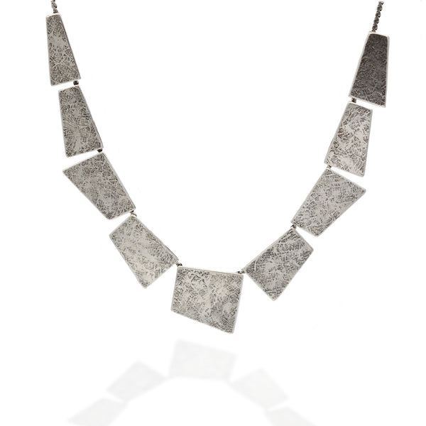 Geometrical cut silver metal statement necklace