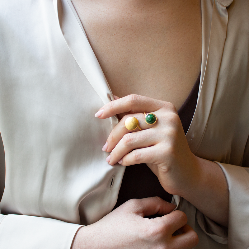 Button style gold open ring with green stone