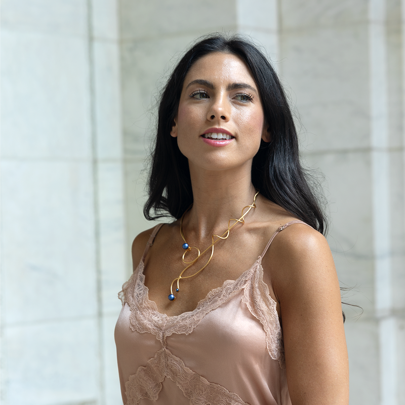 Gold statement necklace with blue pearl