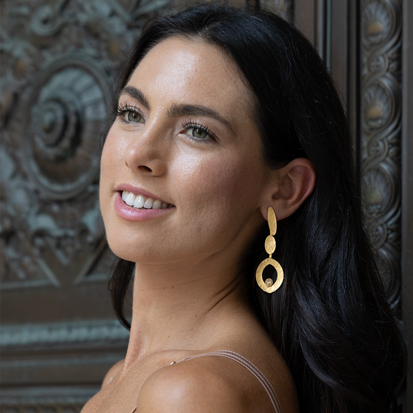 Gold dangle earrings with crystals