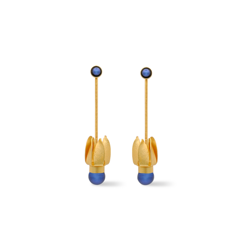 Gold tulip dangle earrings adorned with a dark blue