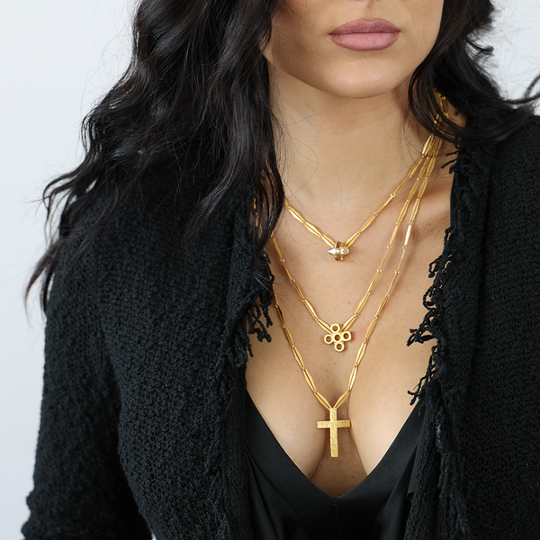 gold three layered cross necklace with green crystal