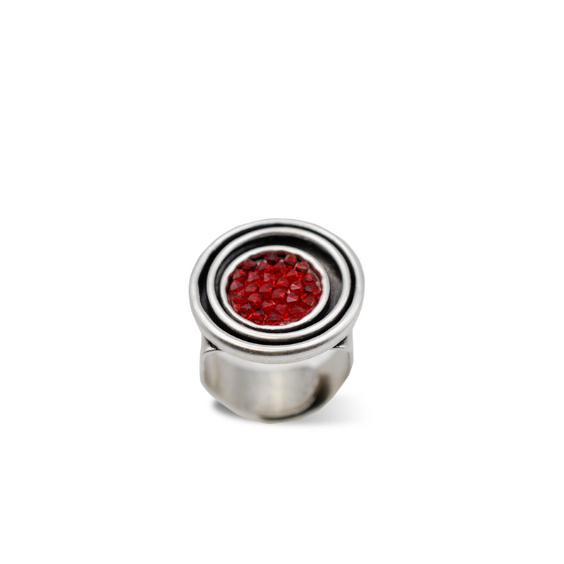 Round silver statement ring with red shimmer crystal