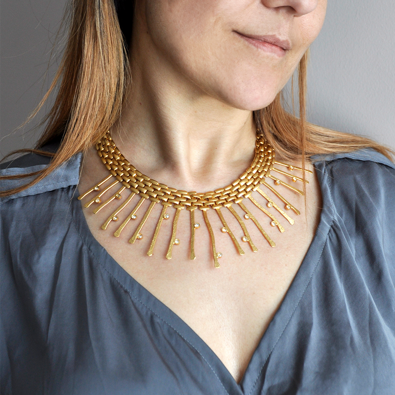 gold collar necklace with thick chain and golden crystals