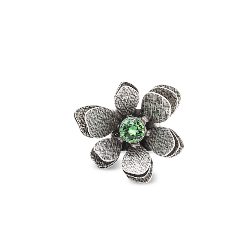 silver flower statement ring with green crystal
