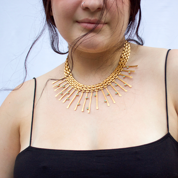 Gold statement necklace with crystals for evening dress
