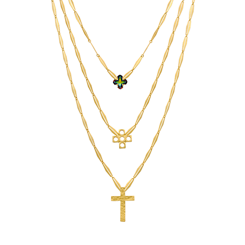 gold layered cross necklace with green crystal