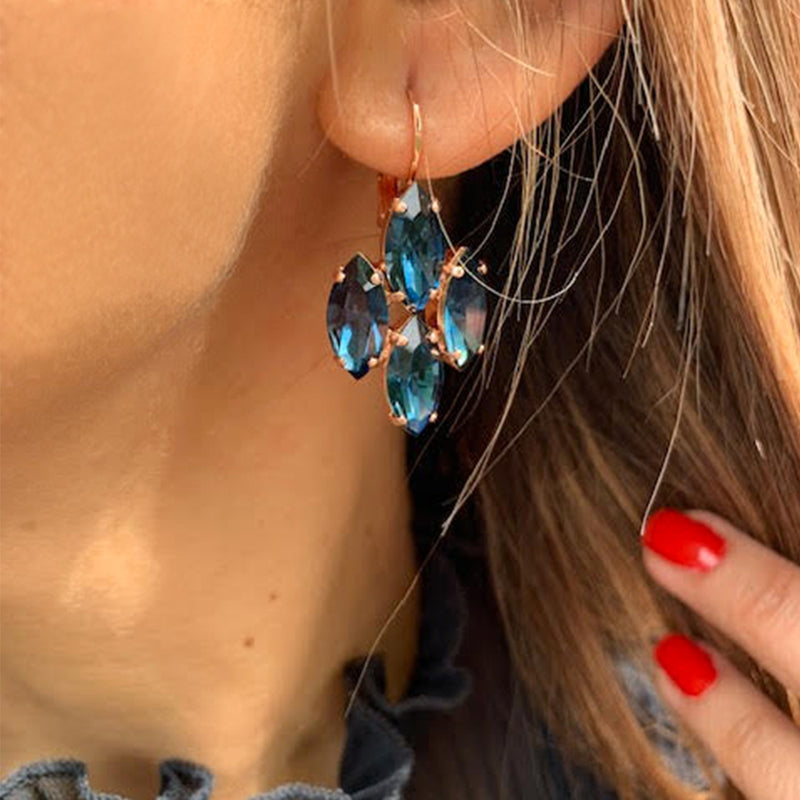 rose gold dangle earrings with marquise shape montana blue crystal