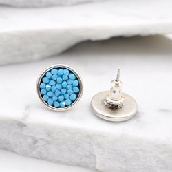 Silver round stud earrings with turquoise Swarovski crystals